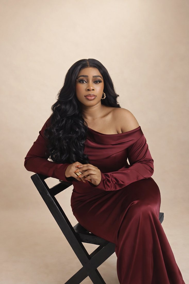 Natalie Usen in a burgundy dress
